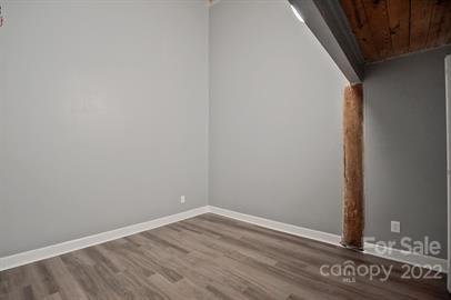 201 South Hoskins Road, Unit 111 Charlotte, NC 28208 - Photo 14 of 16 a view of a small space with wooden floor and a window