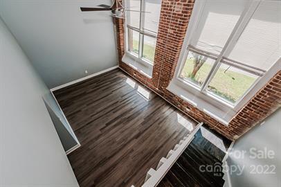 201 South Hoskins Road, Unit 111 Charlotte, NC 28208 - Photo 15 of 16 a view of an empty room and wooden floor