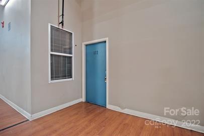201 South Hoskins Road, Unit 111 Charlotte, NC 28208 - Photo 4 of 16 a view of an empty room with a window