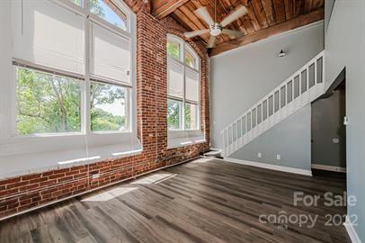 201 South Hoskins Road, Unit 111 Charlotte, NC 28208 - Photo 5 of 16 a view of an entryway with wooden floor