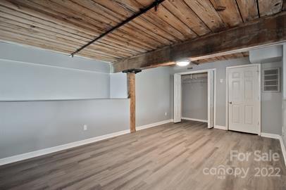 201 South Hoskins Road, Unit 111 Charlotte, NC 28208 - Photo 10 of 16 a view of empty room with wooden floor