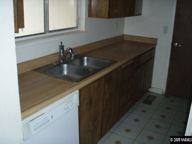 10019 Humite Lane Reno, NV 89506 - Photo 3 of 4 a kitchen with a sink and cabinets