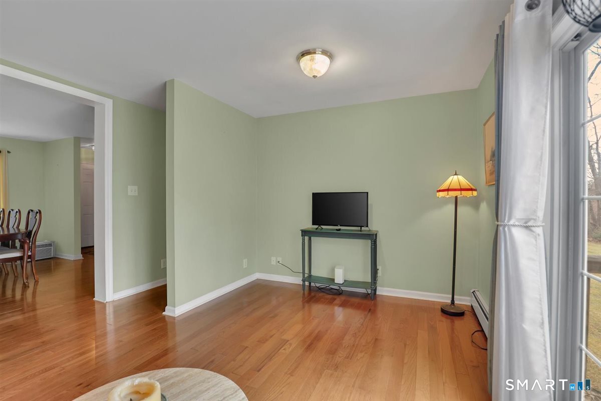 240 Elm Street Old Saybrook, CT 06475 - Photo 11 of 24 a view of a livingroom with furniture and wooden floor