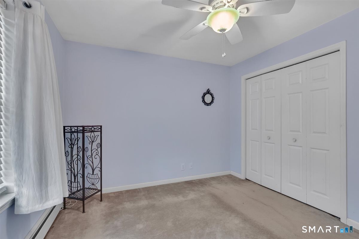 240 Elm Street Old Saybrook, CT 06475 - Photo 15 of 24 a view of an empty room with a window
