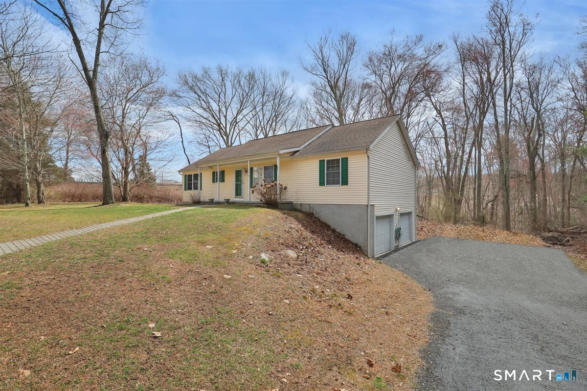 240 Elm Street Old Saybrook, CT 06475 - Photo 2 of 24 a view of house with a yard