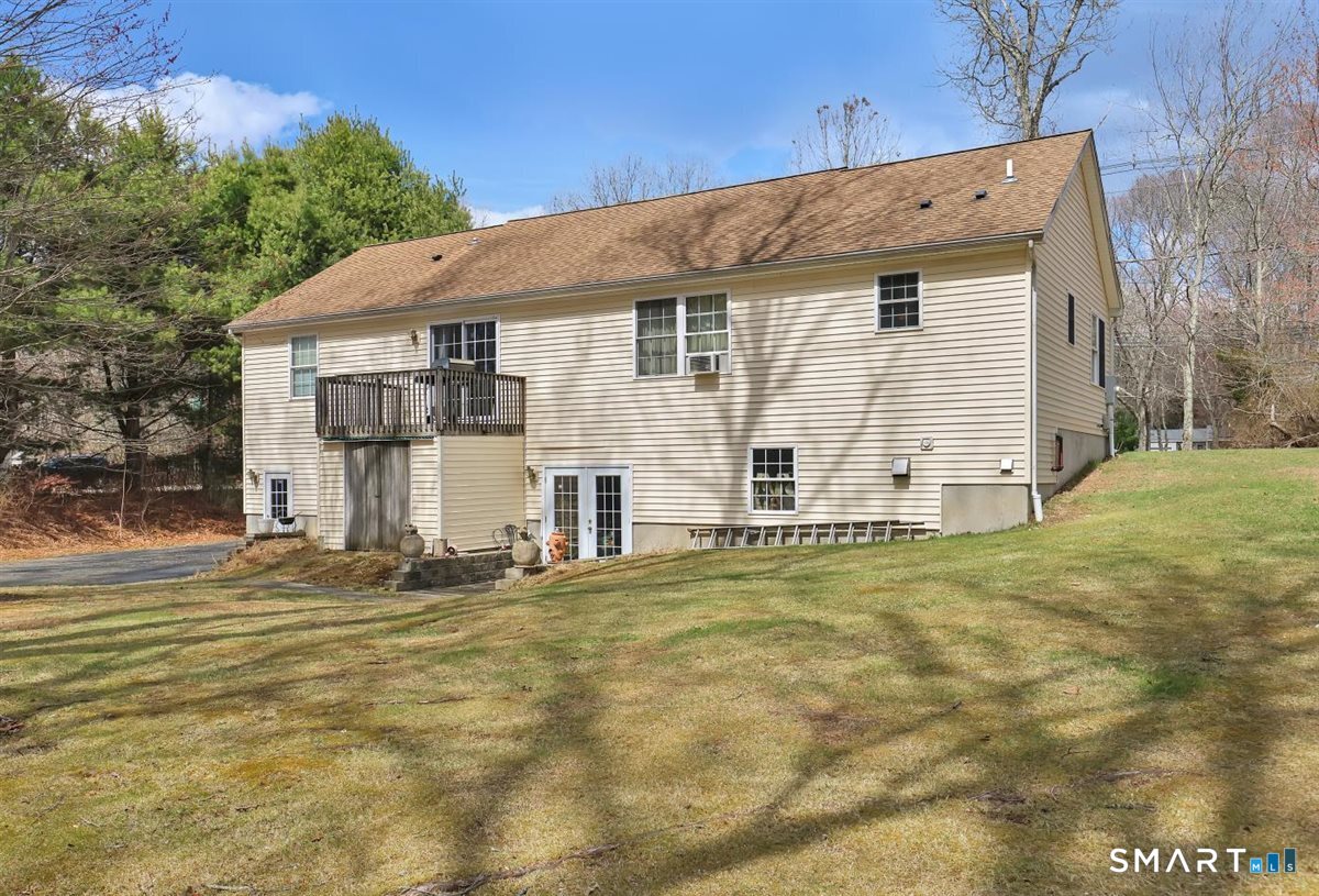 240 Elm Street Old Saybrook, CT 06475 - Photo 3 of 24 a view of a house with a yard and garage