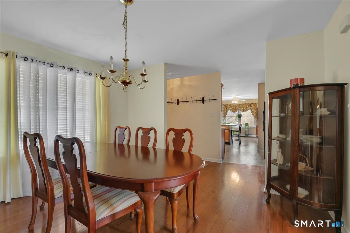 240 Elm Street Old Saybrook, CT 06475 - Photo 4 of 24 a dining room with furniture and window