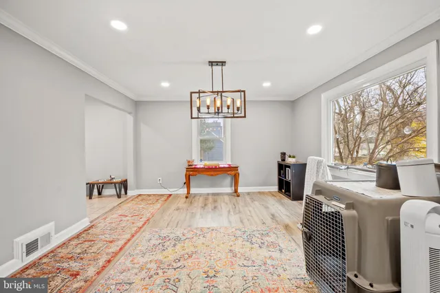 a bedroom with furniture and a chandelier