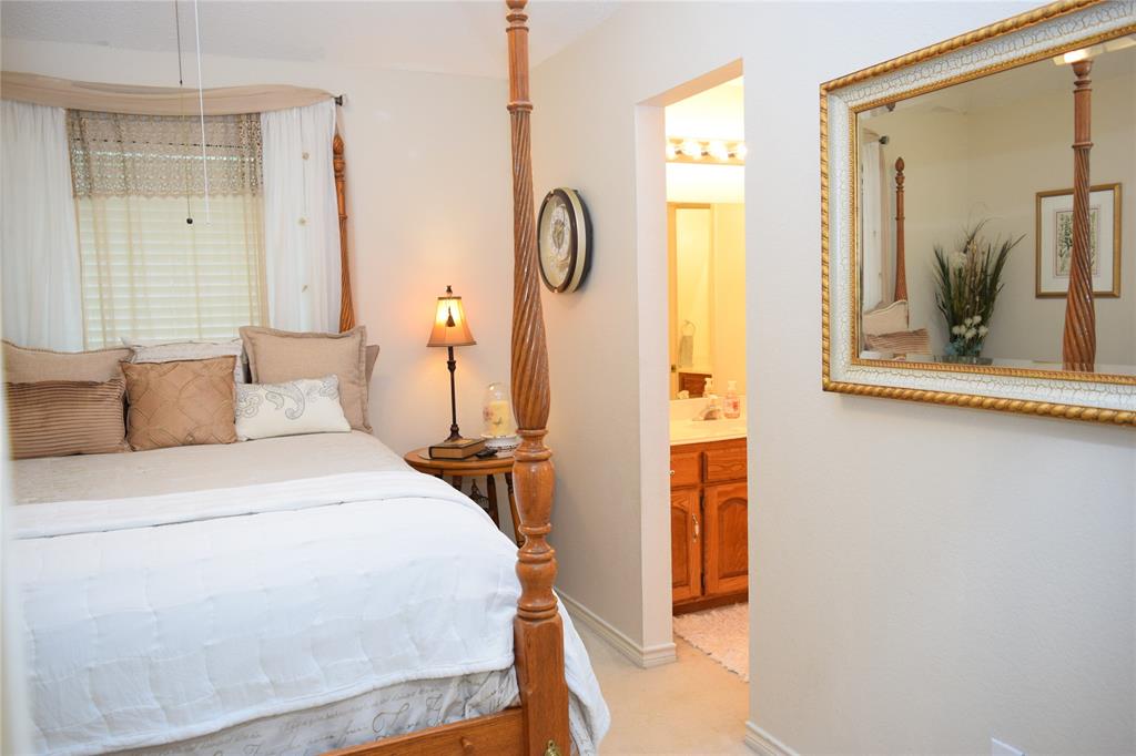 4201 Glistening Spring Rowlett, TX 75088 - Photo 18 of 33 Bedroom with soft neutral wall color and window with blinds