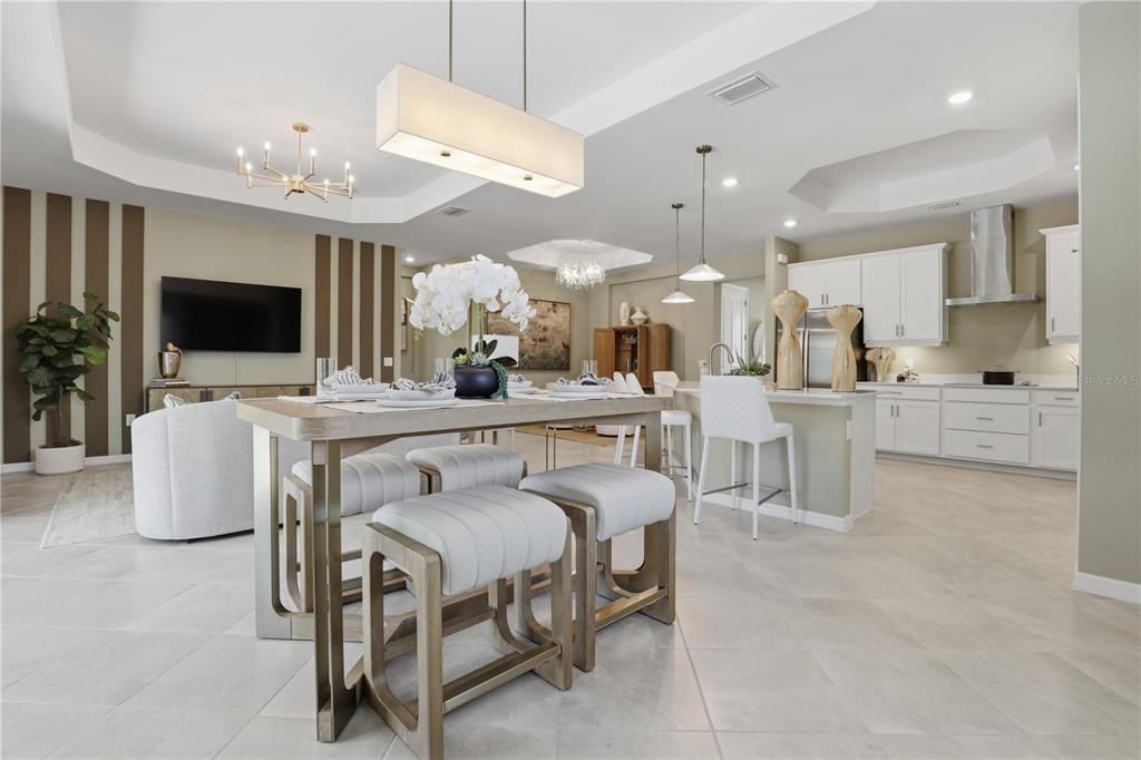 7153 Inlet Isles Lakewood Ranch, FL 34202 - Photo 14 of 26 a large kitchen with a table and chairs