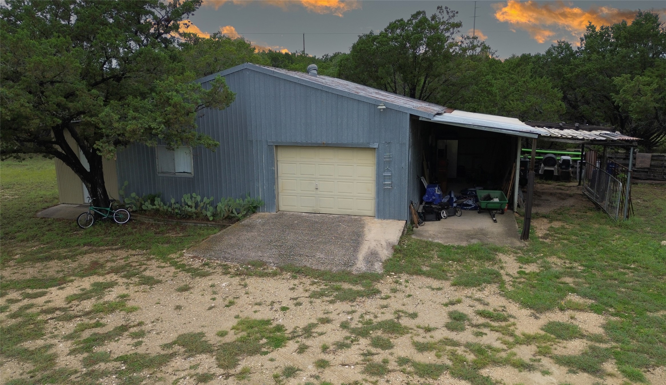 27600 Ranch To Market 1431 Marble Falls, TX 78654 - Photo 30 of 33 Large Metal Barn has One Car Garage with Roll - Up Door and 2 Covered Carports
