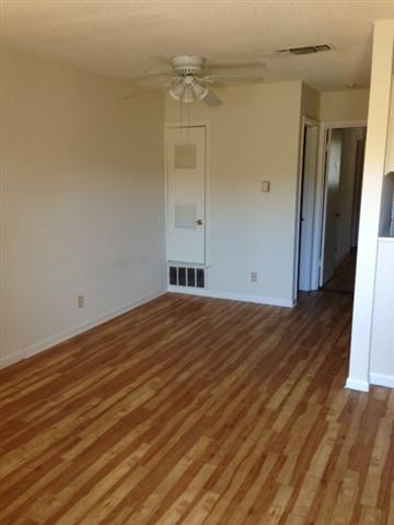 5001 Bull Creek Road, Unit 115 Austin, TX 78731 - Photo 2 of 8 a view of empty room with wooden floor