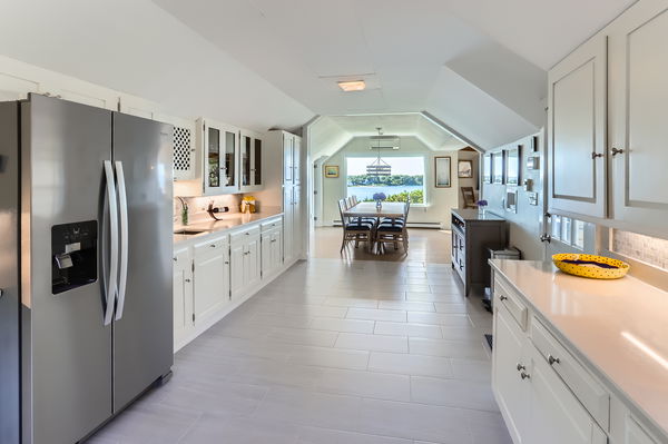 217 Barnes Road Oak Bluffs, MA 02557 - Photo 18 of 60 a kitchen with stainless steel appliances granite countertop a refrigerator and a view of living room