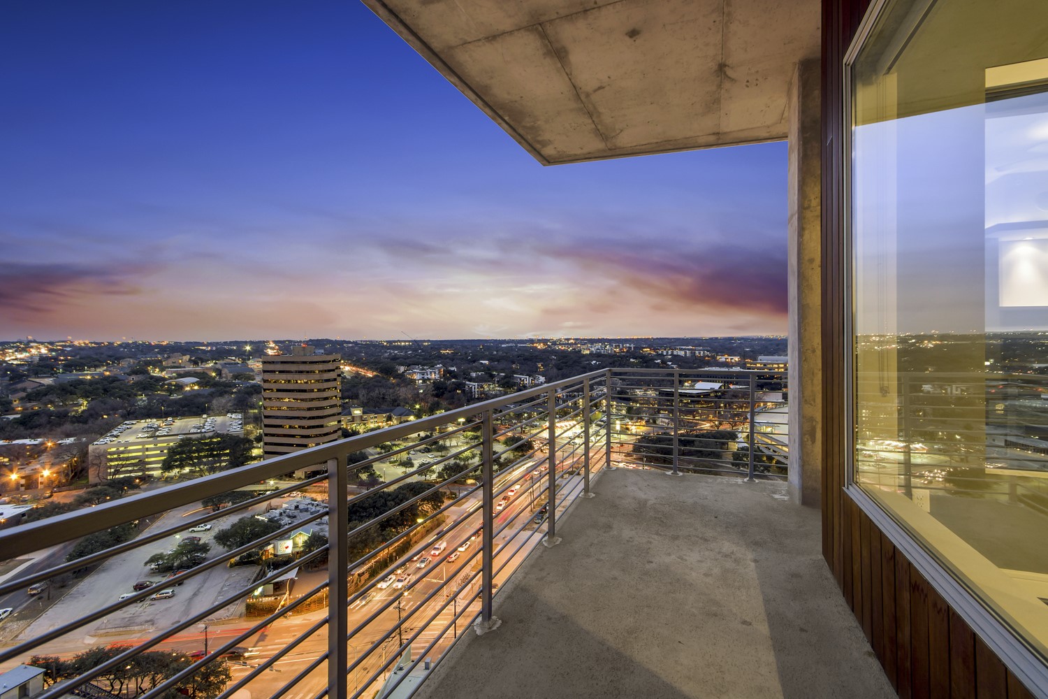 214 Barton Springs Road, Unit 1909 Austin, TX 78704 - Photo 27 of 34 Balcony at dusk featuring a view of city