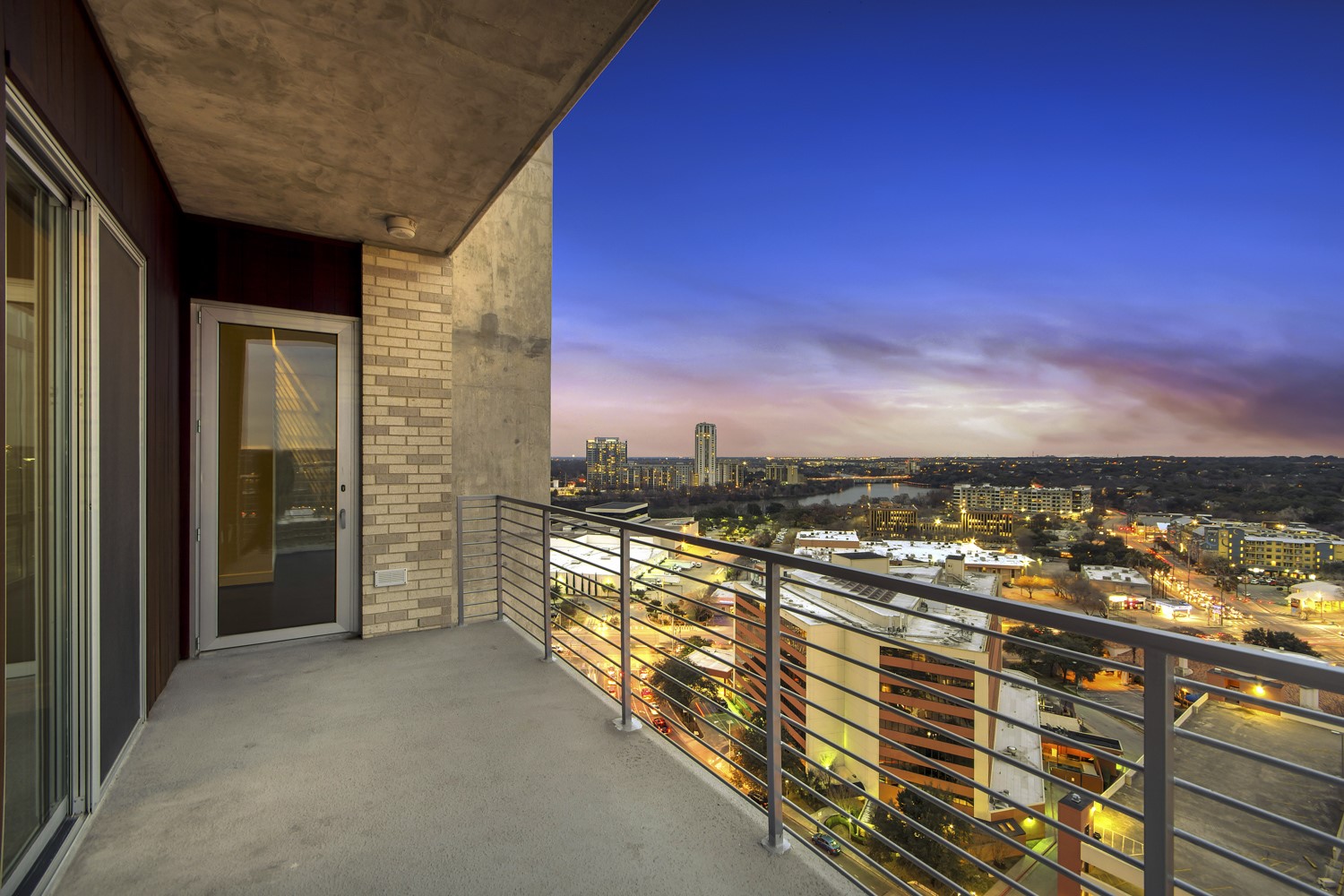 214 Barton Springs Road, Unit 1909 Austin, TX 78704 - Photo 29 of 34 Balcony at dusk featuring a view of city