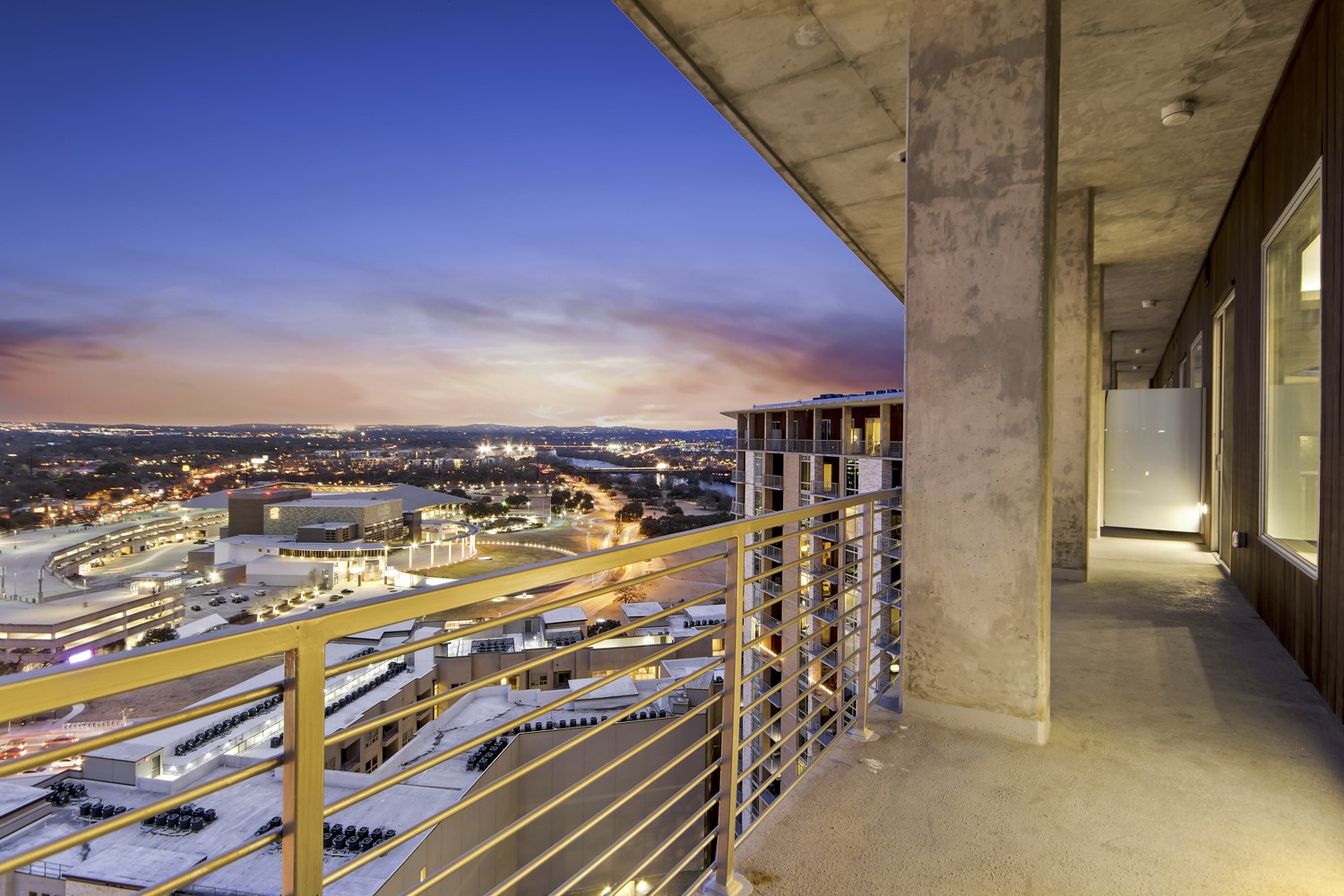 214 Barton Springs Road, Unit 1909 Austin, TX 78704 - Photo 30 of 34 Balcony at dusk featuring a view of city