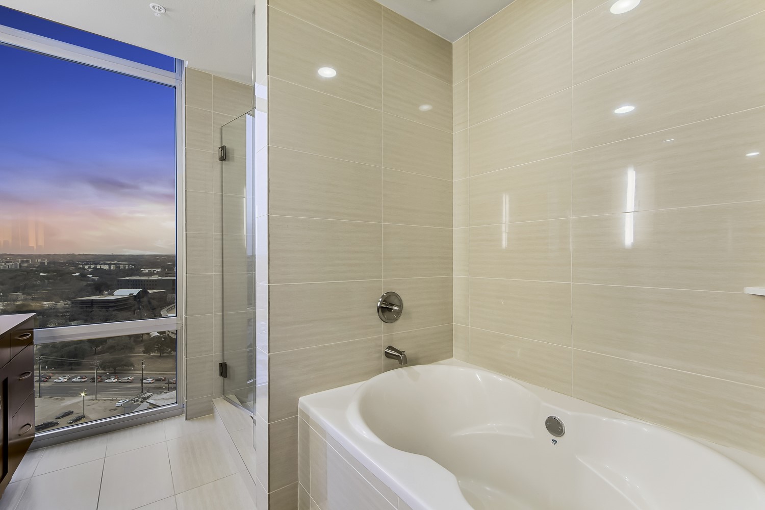 214 Barton Springs Road, Unit 1909 Austin, TX 78704 - Photo 5 of 34 Full bathroom with a bath, tile walls, light tile patterned flooring, vanity, and an enclosed shower