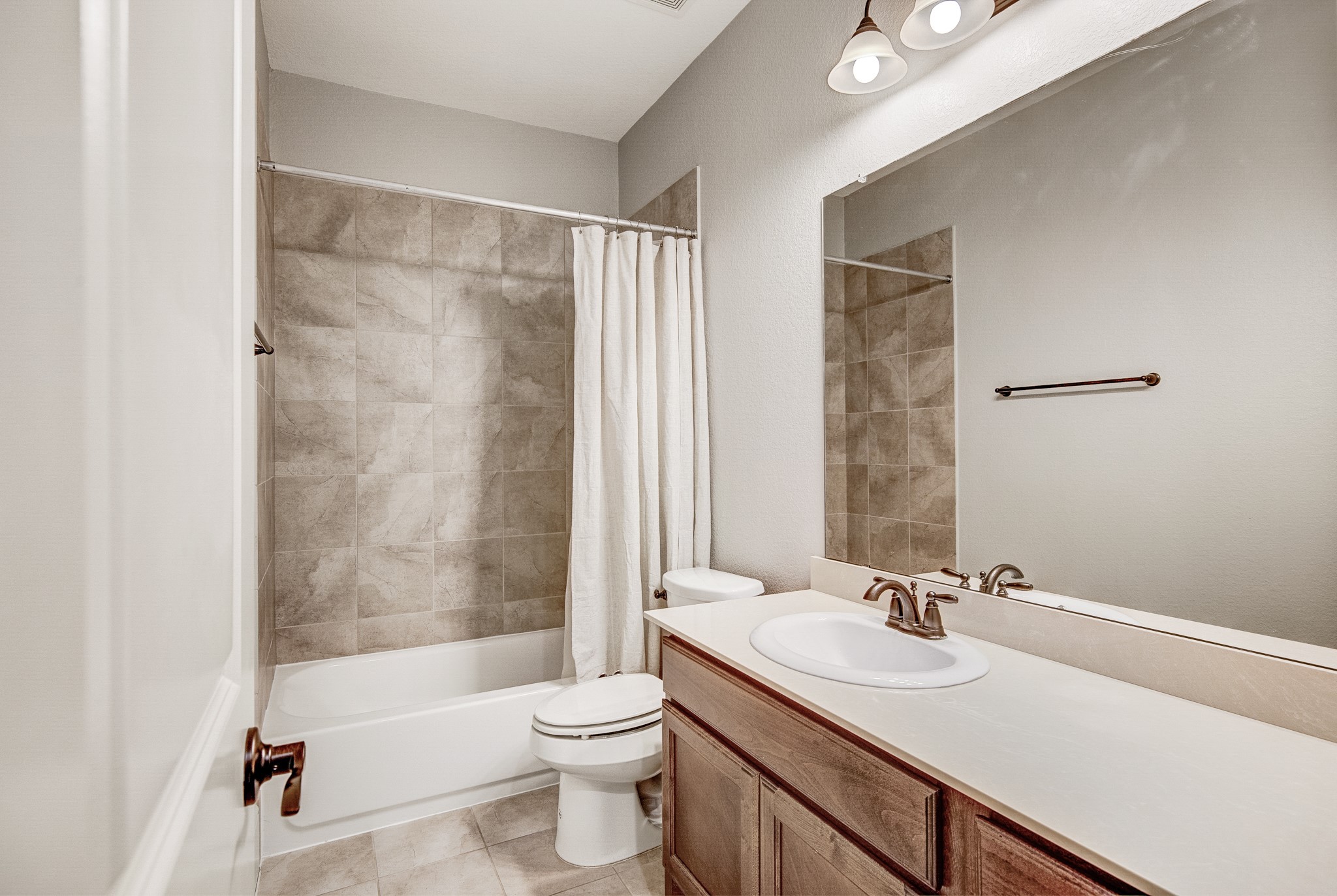 29522 Monona Terrace Court Spring, TX 77386 - Photo 17 of 44 a bathroom with a sink toilet vanity and shower