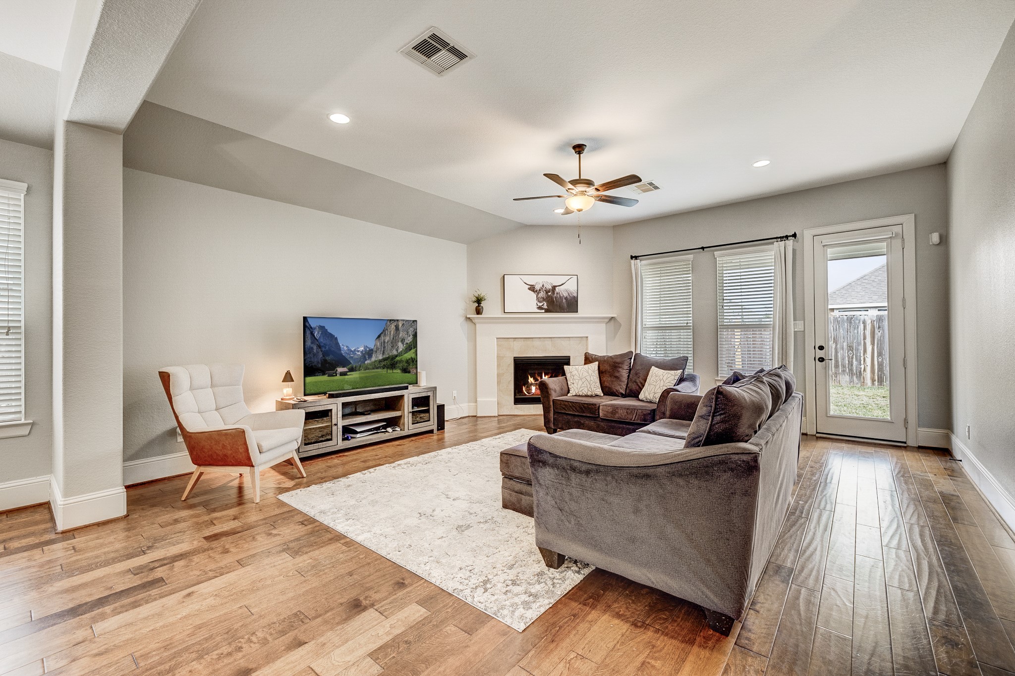 29522 Monona Terrace Court Spring, TX 77386 - Photo 34 of 44 a living room with fireplace furniture and a flat screen tv