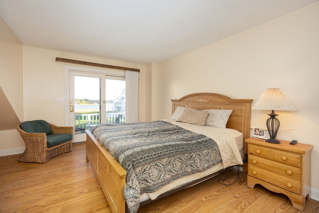 19 Harbourside Road, Unit 19 Quincy, MA 02171 - Photo 22 of 41 a bedroom with a bed and window