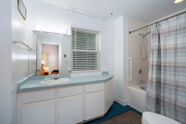 a bathroom with a sink toilet a shower and a bathtub