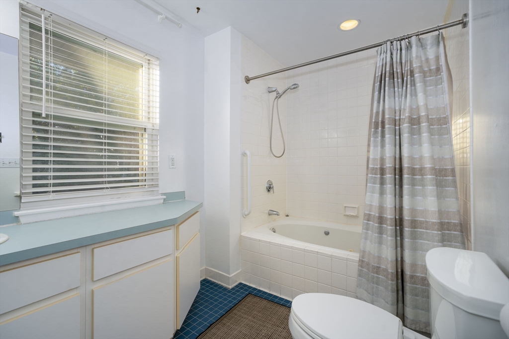 19 Harbourside Road, Unit 19 Quincy, MA 02171 - Photo 28 of 41 a bathroom with a sink toilet a shower and a bathtub