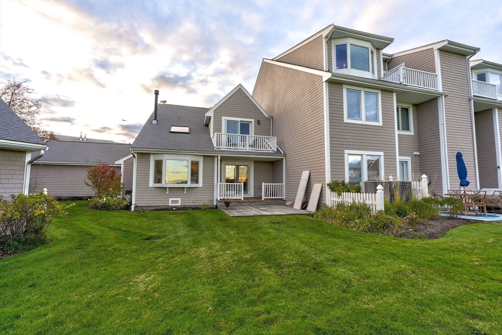 19 Harbourside Road, Unit 19 Quincy, MA 02171 - Photo 32 of 41 a front view of a house with a yard