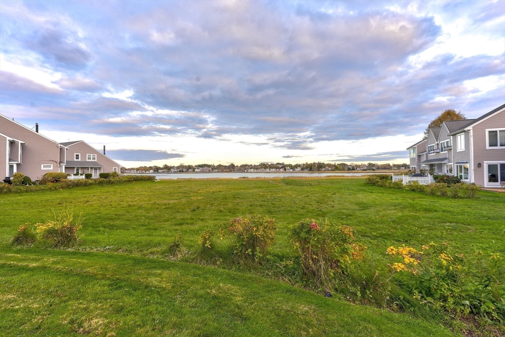 19 Harbourside Road, Unit 19 Quincy, MA 02171 - Photo 33 of 41 a view of an ocean with a big yard