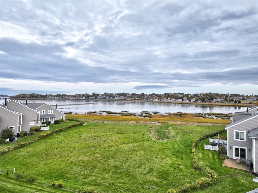 19 Harbourside Road, Unit 19 Quincy, MA 02171 - Photo 37 of 41 a view of a lake with houses in the back