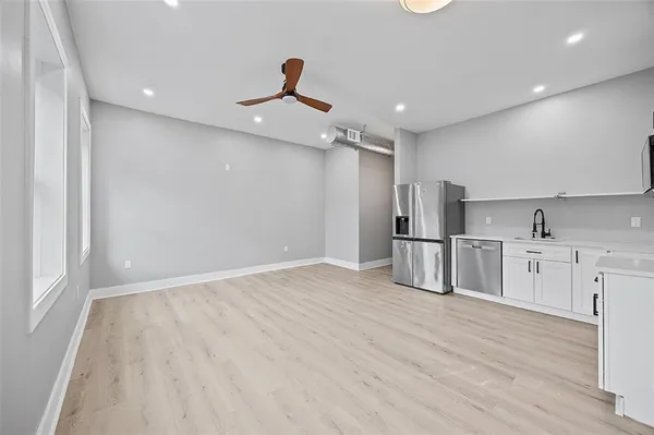 a view of a kitchen with electric appliances
