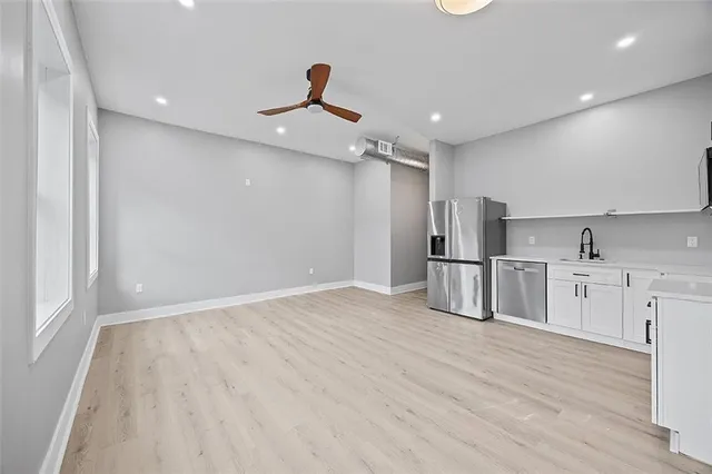 a view of a kitchen with electric appliances