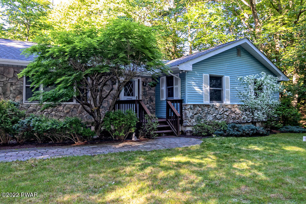 166 Devils Hole Road Cresco, PA 18326 - Photo 35 of 46 a view of a house with a yard and plants
