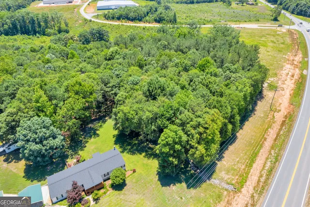 a view of a garden with a house