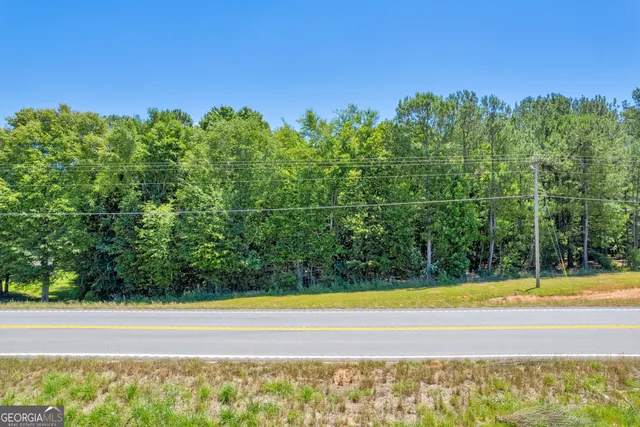 a view of a swimming pool with an outdoor space and seating area