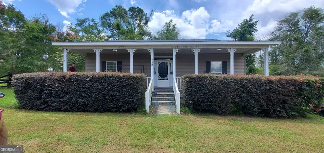 front view of a house with a yard