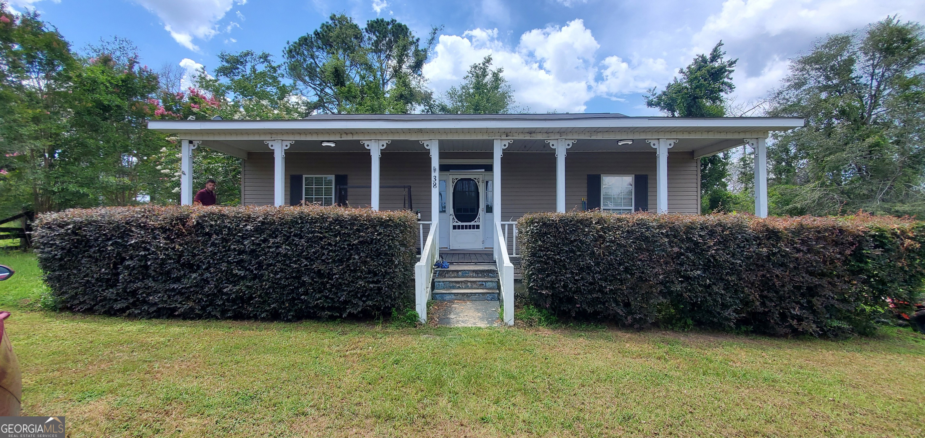 front view of a house with a yard