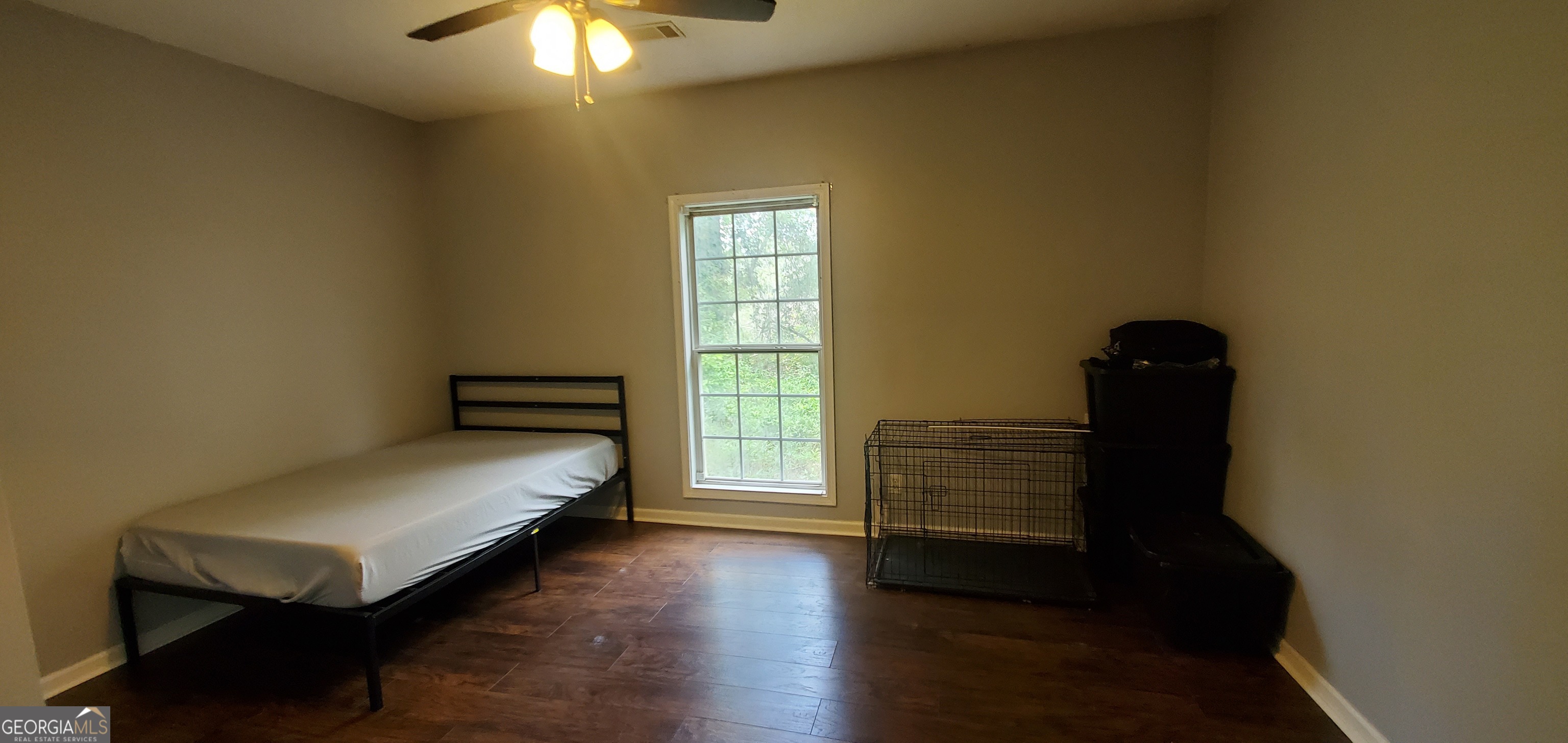 38 Highway 46 Lyons, GA 30436 - Photo 12 of 44 a bedroom with a bed and a window