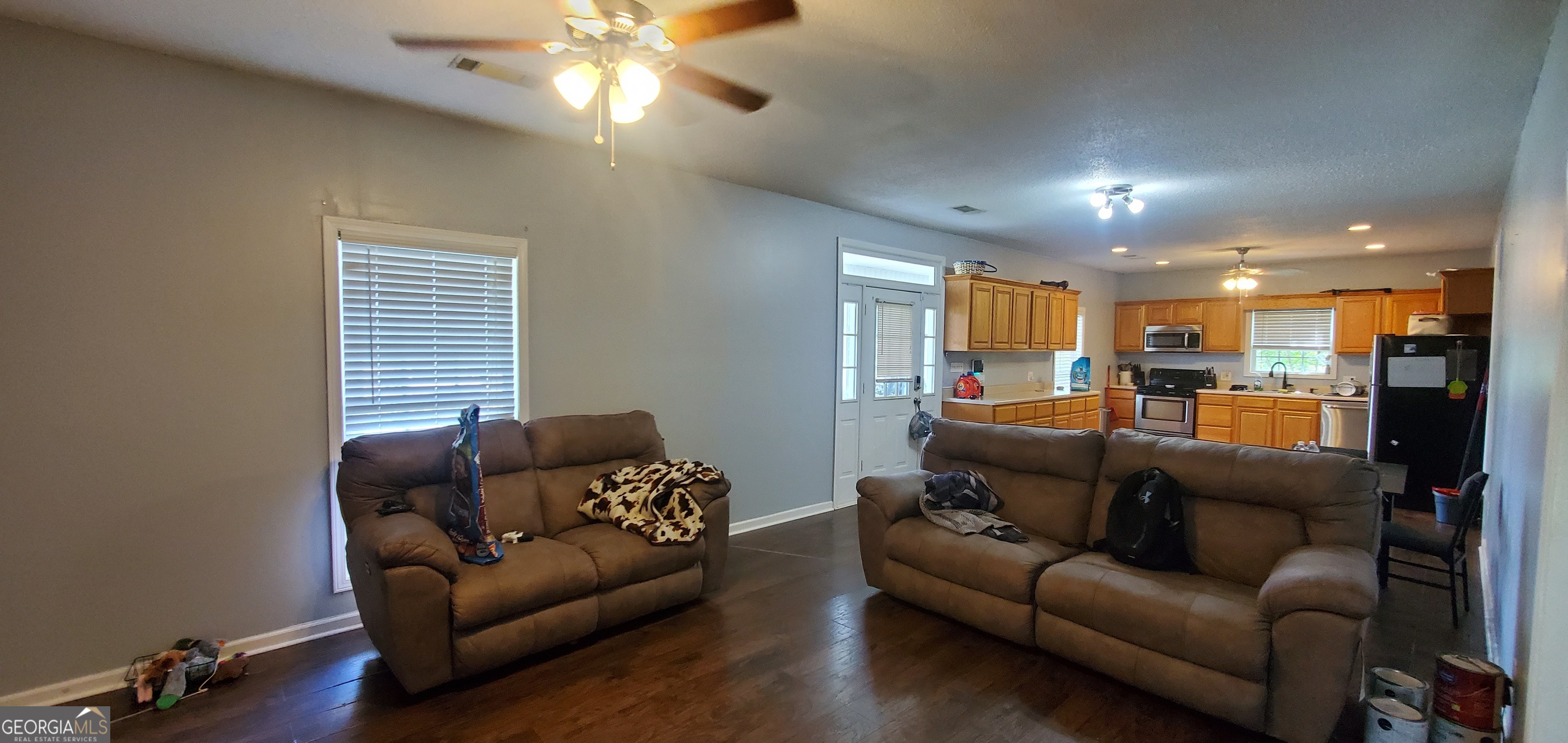 38 Highway 46 Lyons, GA 30436 - Photo 14 of 44 a living room with furniture and a chandelier