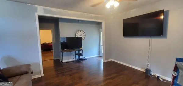 a living room with furniture and a window