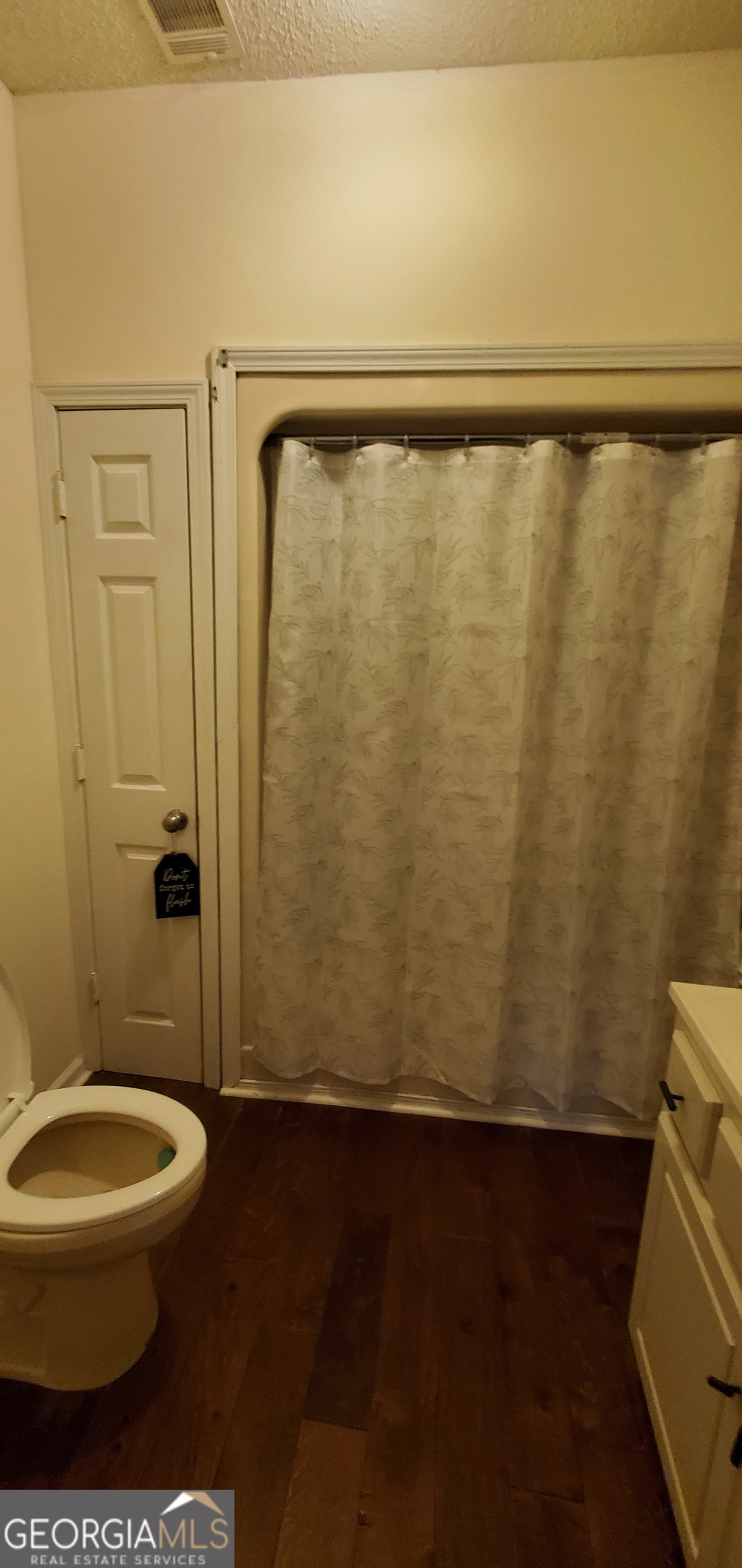 38 Highway 46 Lyons, GA 30436 - Photo 17 of 44 a bathroom with a toilet and a shower