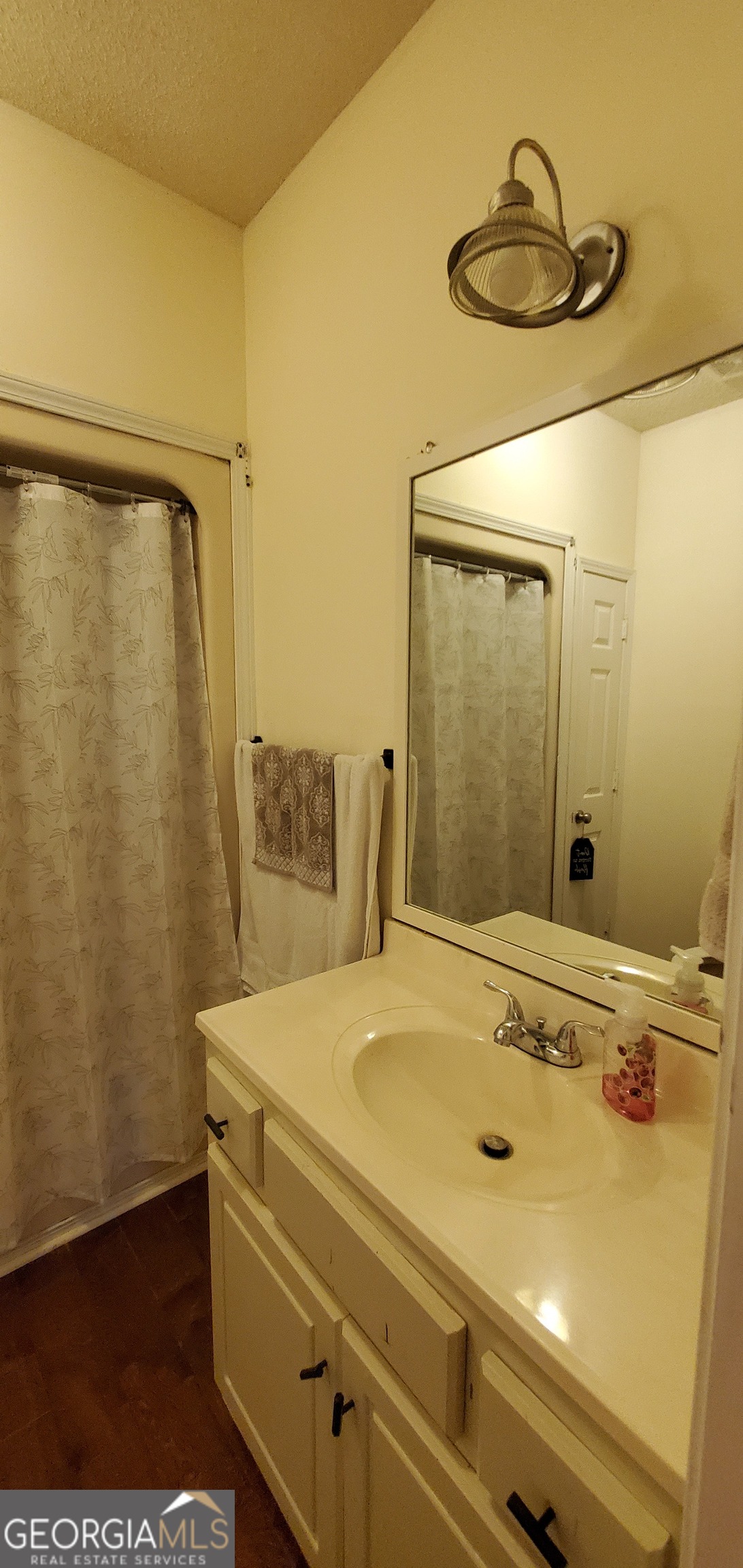 38 Highway 46 Lyons, GA 30436 - Photo 18 of 44 a bathroom with a sink and a mirror