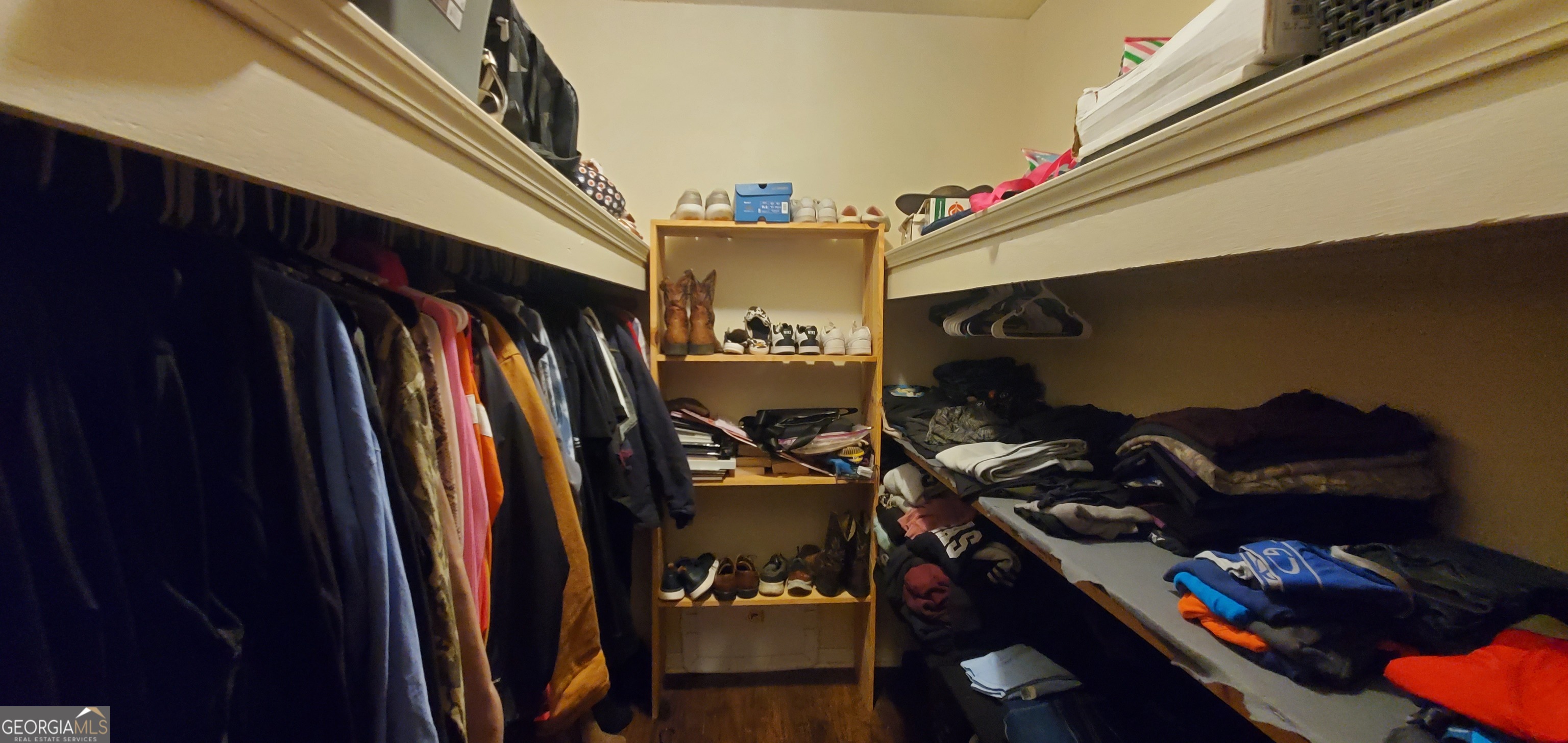 38 Highway 46 Lyons, GA 30436 - Photo 19 of 44 a view of walk in closet with clothes and shoes