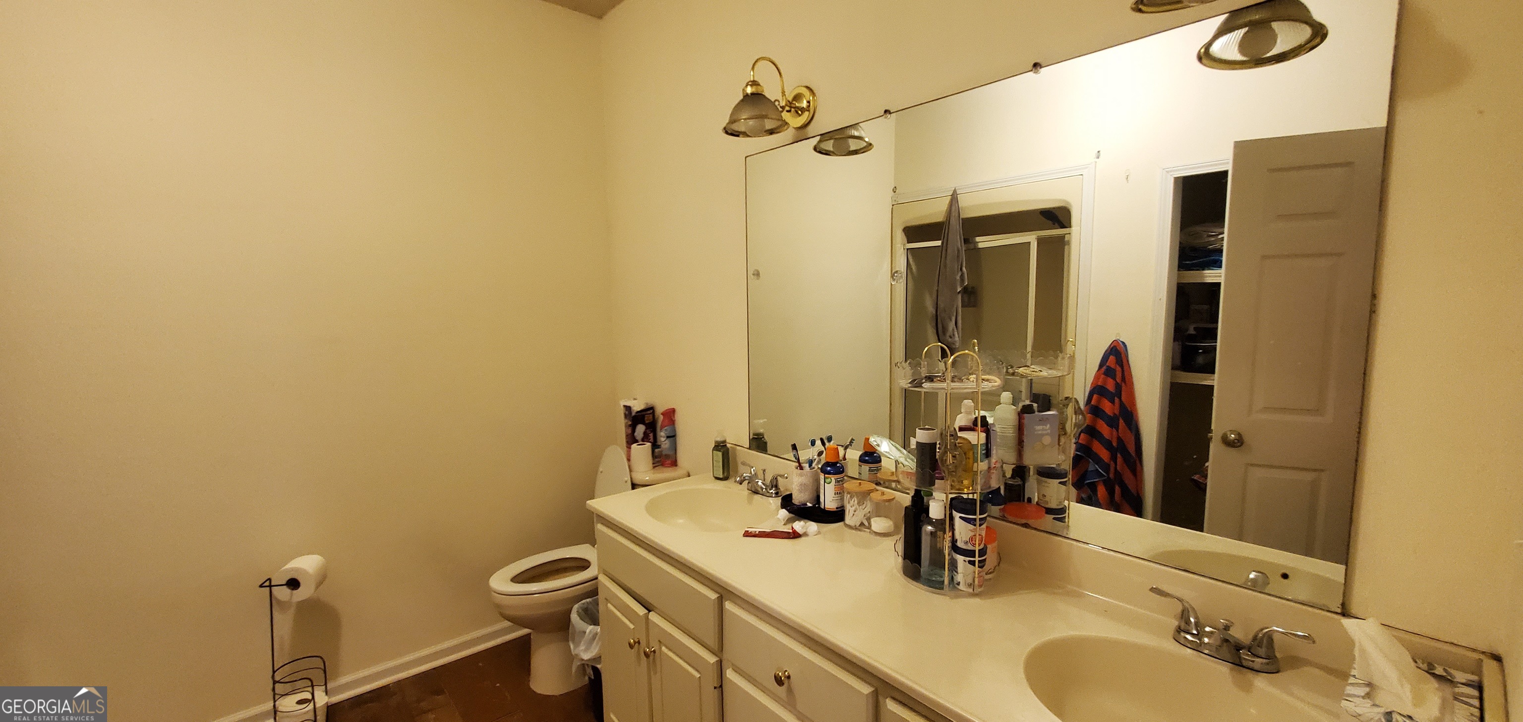 38 Highway 46 Lyons, GA 30436 - Photo 20 of 44 a bathroom with a sink and a mirror