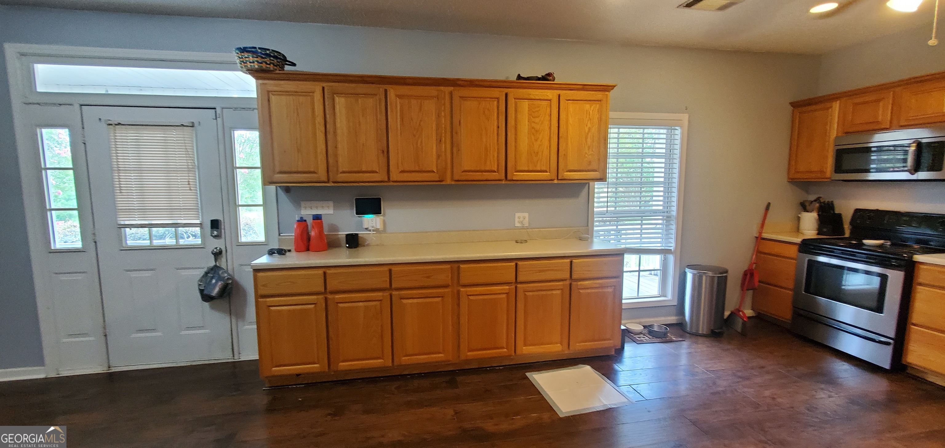 38 Highway 46 Lyons, GA 30436 - Photo 27 of 44 a kitchen with stainless steel appliances granite countertop a stove a sink and a refrigerator