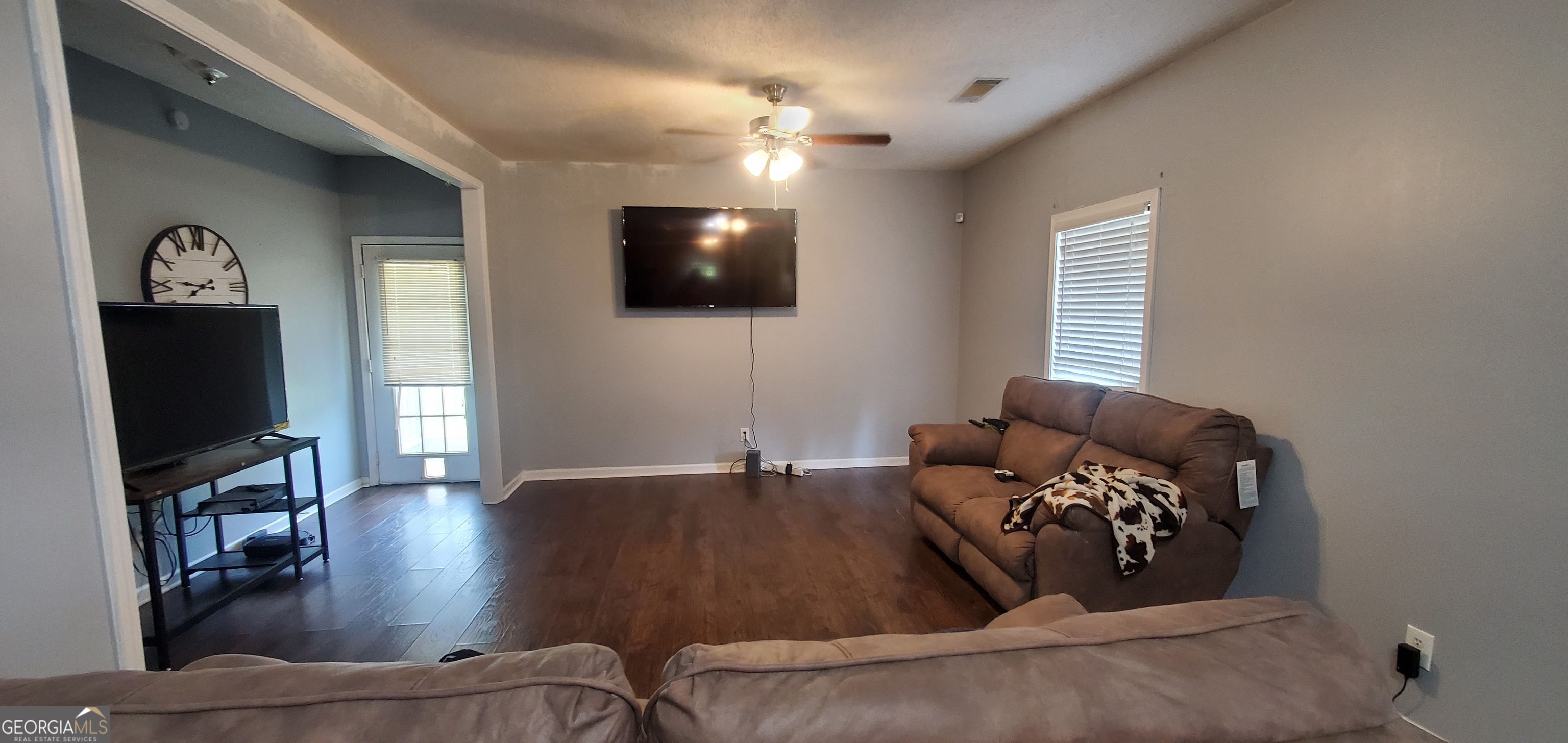 38 Highway 46 Lyons, GA 30436 - Photo 29 of 44 a living room with furniture and a flat screen tv