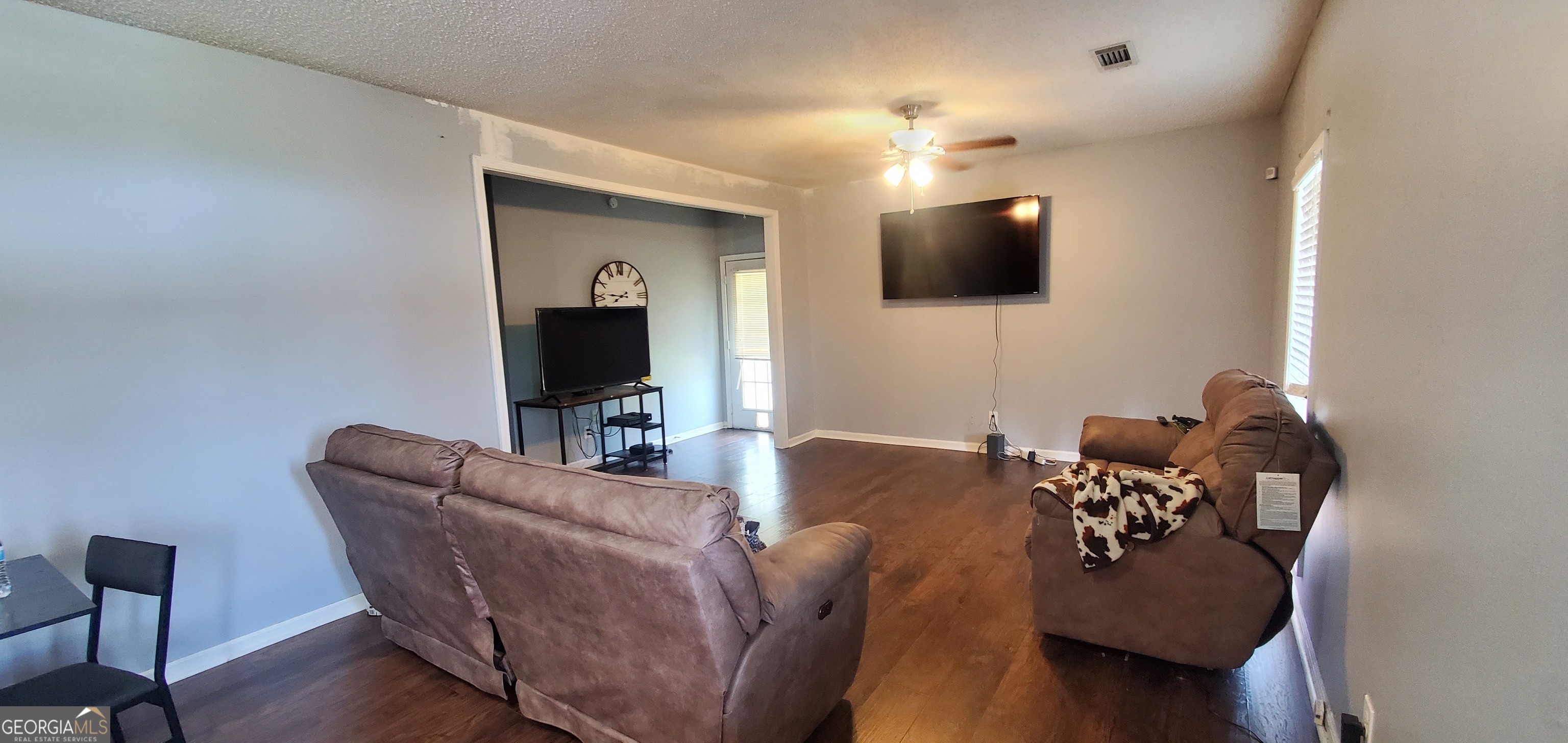 38 Highway 46 Lyons, GA 30436 - Photo 30 of 44 a living room with furniture and a flat screen tv
