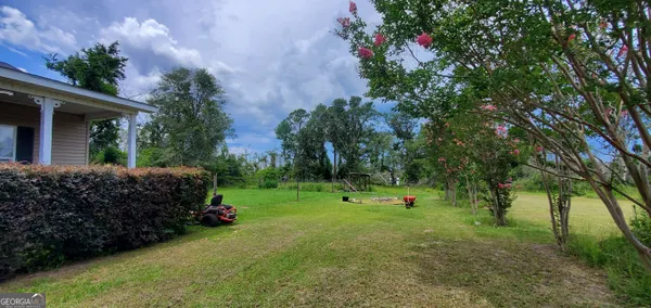a view of a garden with a bridge