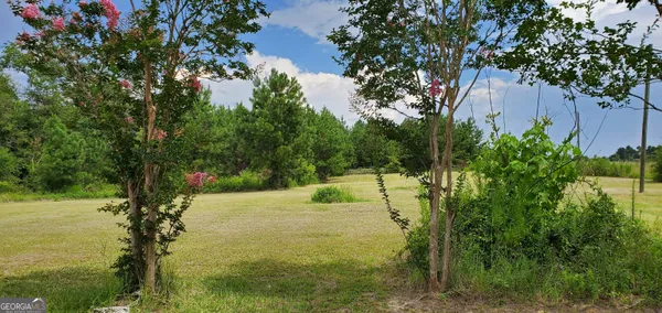 a view of a porch with wooden floor