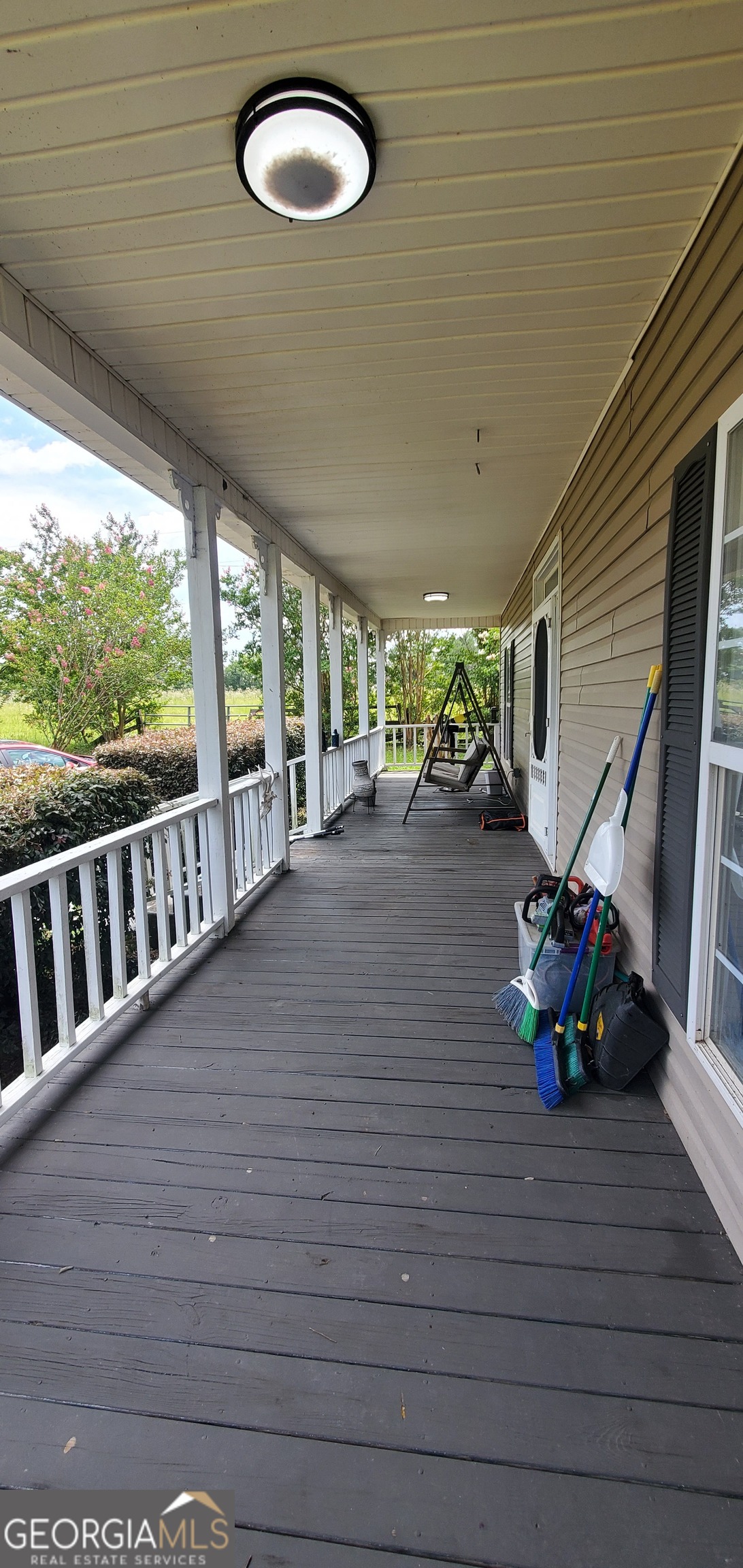 38 Highway 46 Lyons, GA 30436 - Photo 34 of 44 a view of a porch with wooden floor