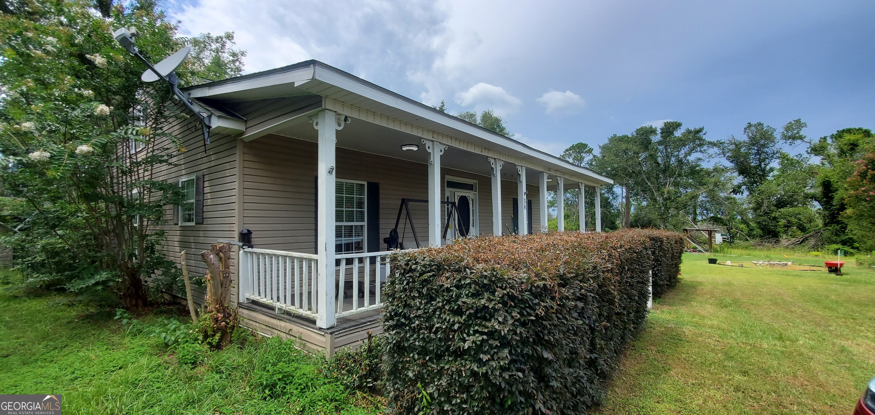 38 Highway 46 Lyons, GA 30436 - Photo 36 of 44 front view of a house with a yard